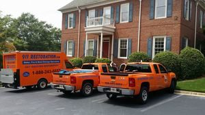 Water Cleanup Vehicles at a Commercial Job Site