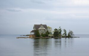 Cottage surrounded by water 